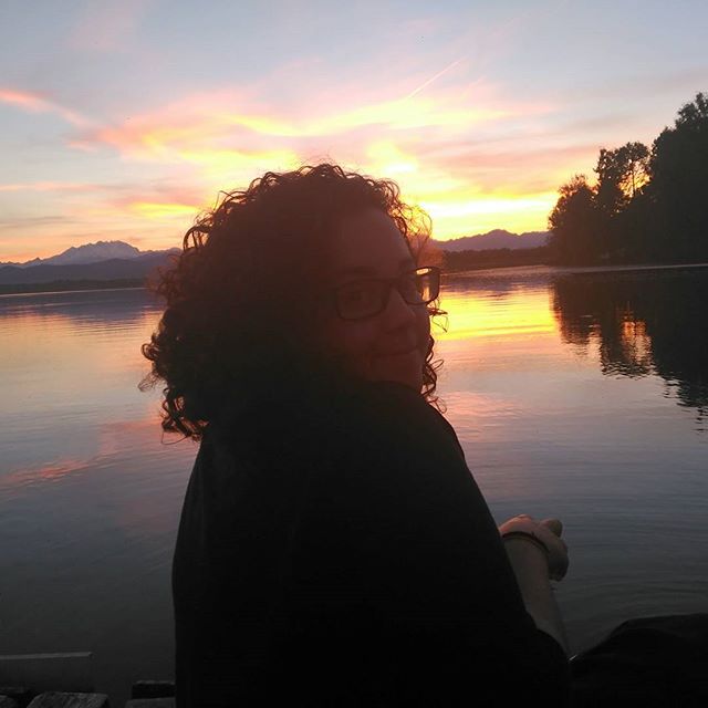 Student in front of a lake