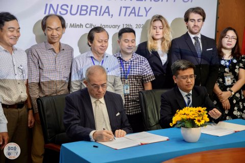 Professor Zamperetti signing and some other people