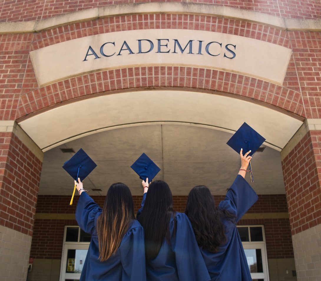 Picture of three girls at a graduation ceremony