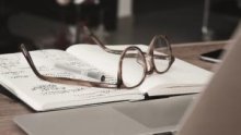 glasses resting on a book