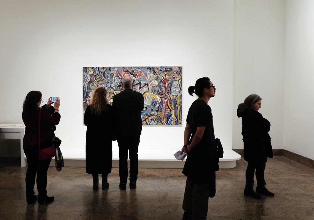 Photos of people visiting an art gallery