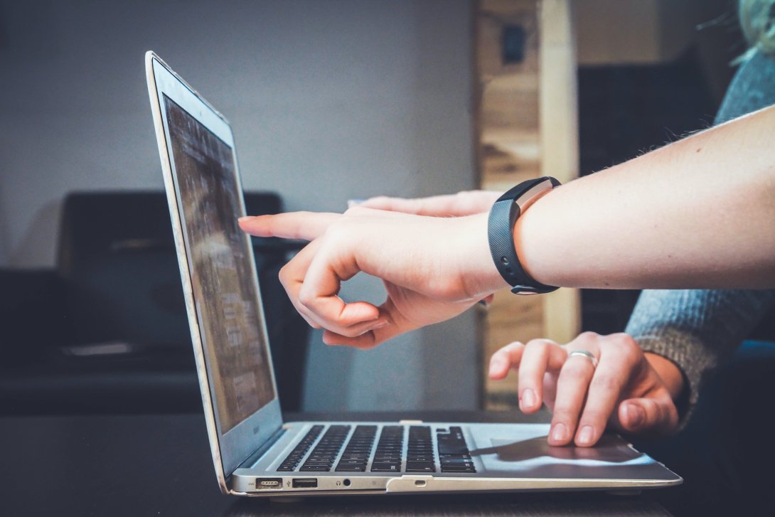 Cover photo, people doing a search on the PC